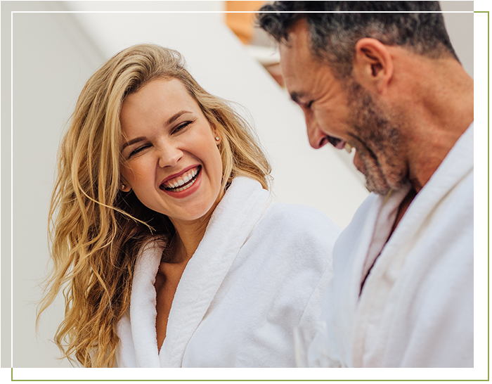 Woman and man laughing at a spa